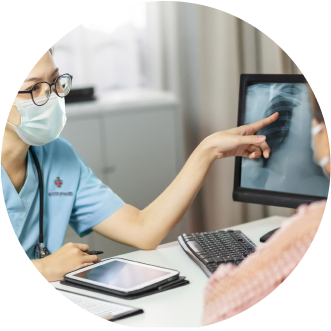 Nurse showing patient a screen with an x-ray